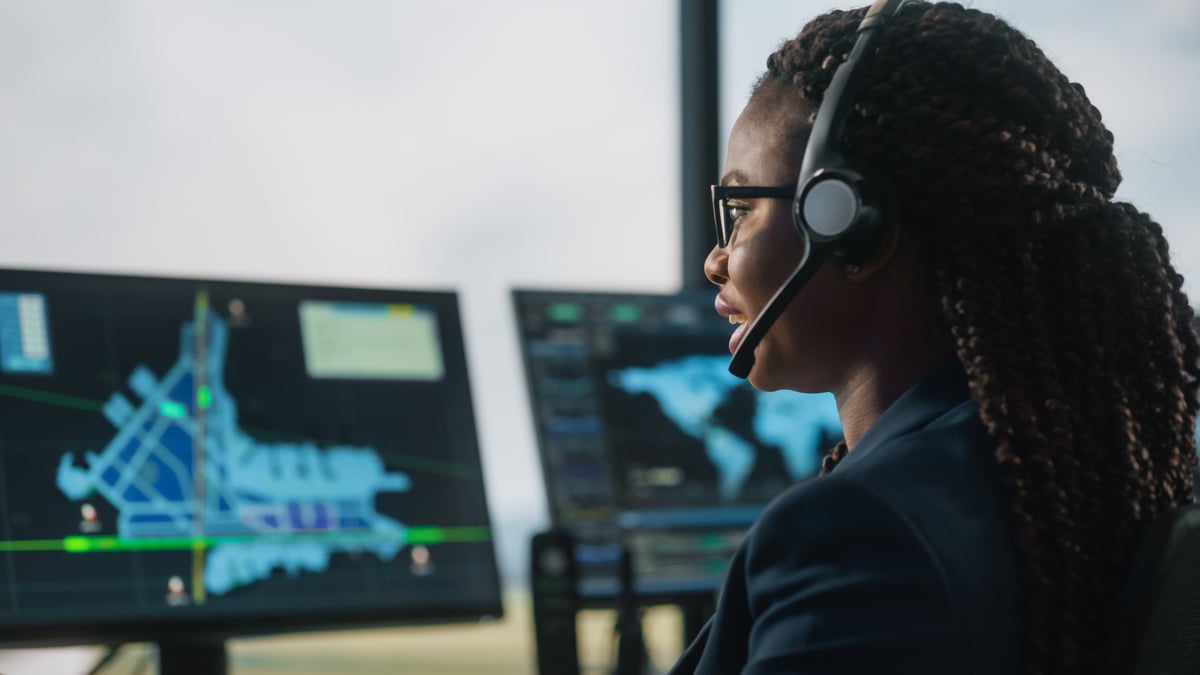A JetBrands dispatcher coordinating an itinerary at a desk